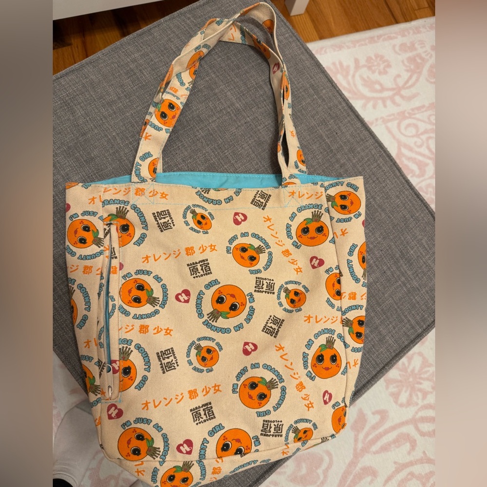 Harajuku Lovers by Gwen Stefani Orange County Girl Tote Bag